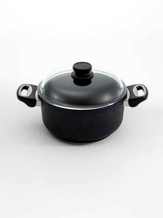 SKK Classic hand-cast tall cooking pot with glass lid, angled view — Made in Germany